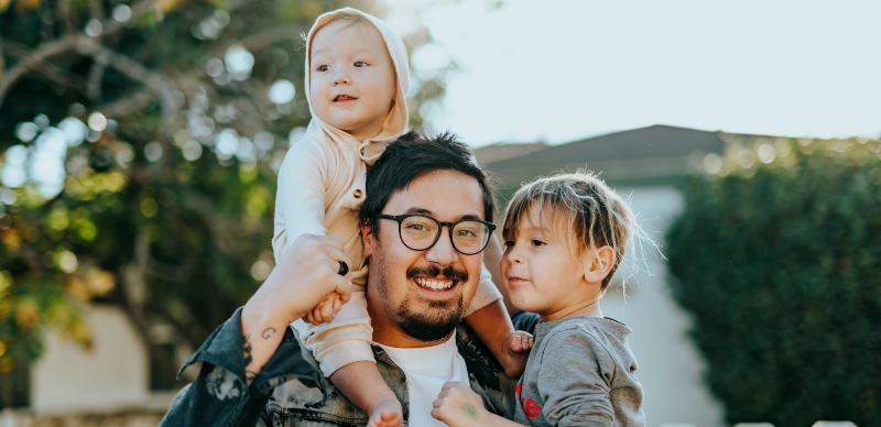 man with two children