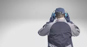 workers wearing headphones to prevent hearing loss