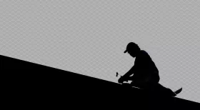 person working on top of roof