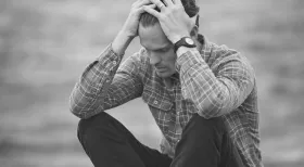 man frustrated when the insurance company is refusing to settle