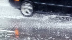 car in rain on New Jersey road