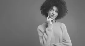 woman thinking about what questions to ask a New York personal injury lawyer