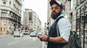 Man in New York looking down street waiting for Uber