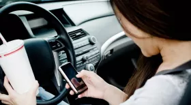 Distracted driver drinking and texting while driving