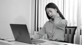 Woman working with whiplash after accident