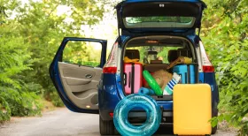 car packing up for summer driving with rafts and floats