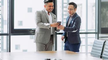 men around office conference table