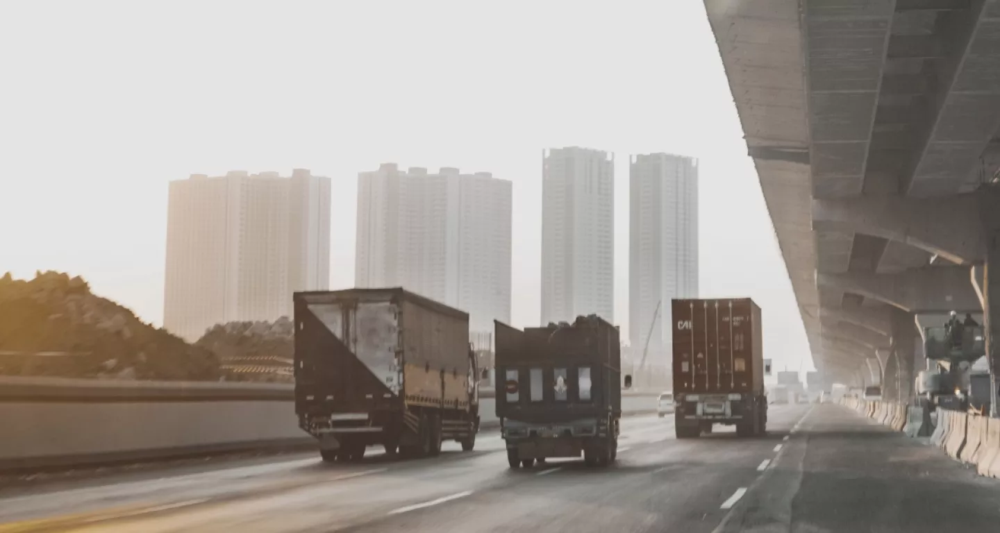 three trucks on a highway