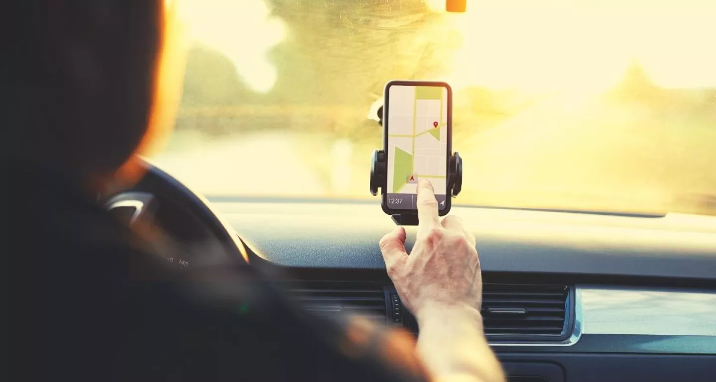 Uber driver looking at app waiting for next ride