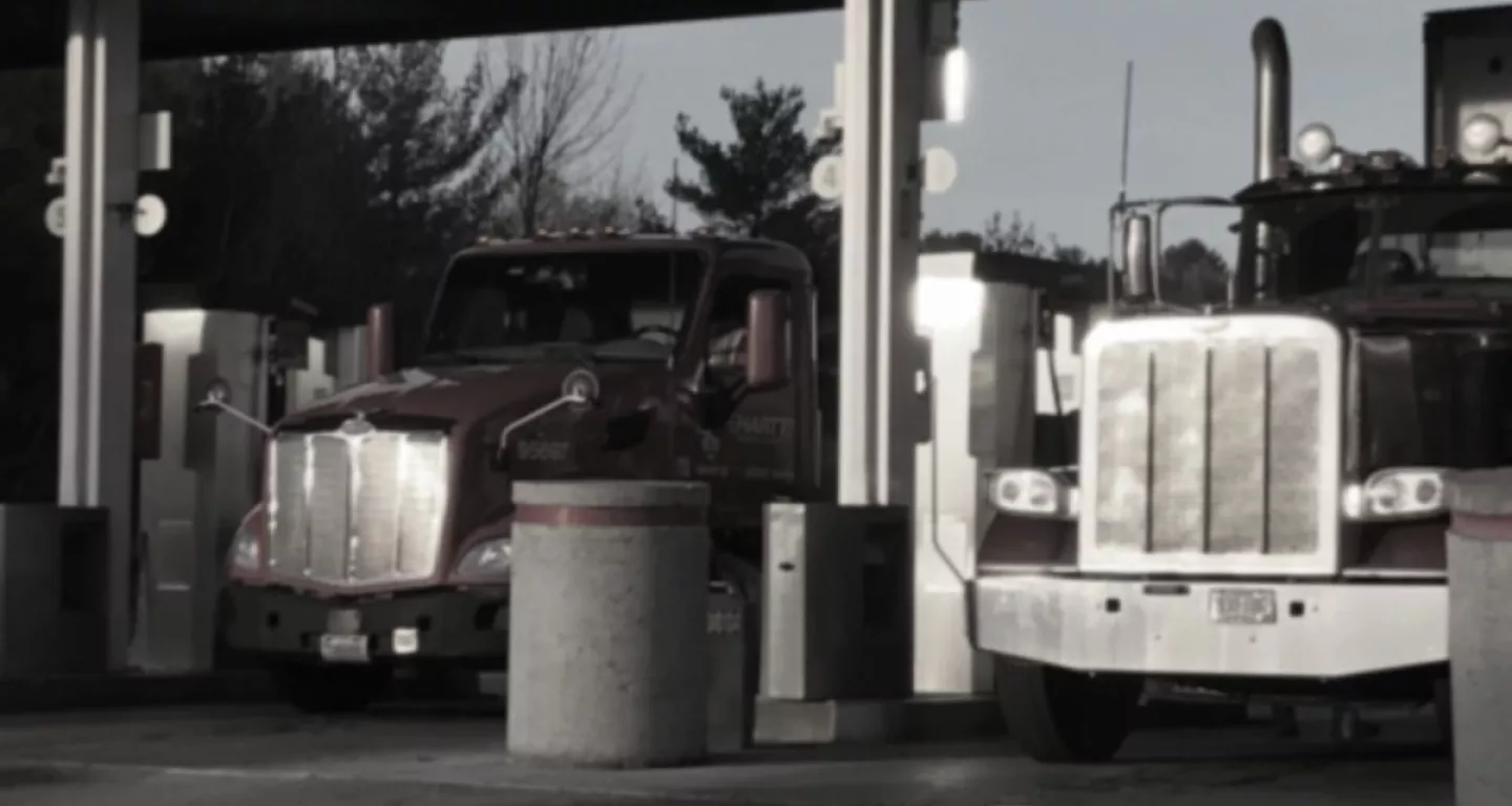 tractor trailers line up at a rest stop in New Jersey