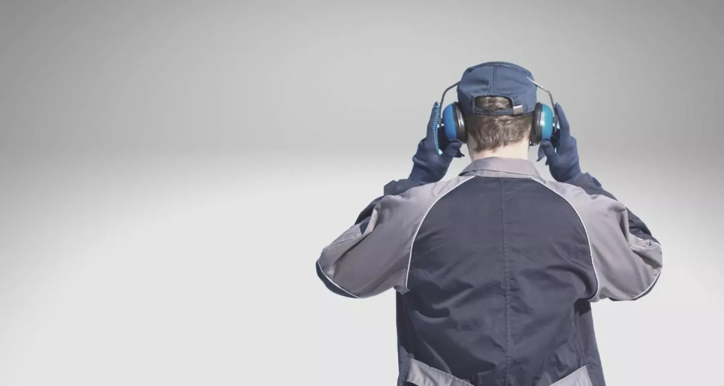 workers wearing headphones to prevent hearing loss