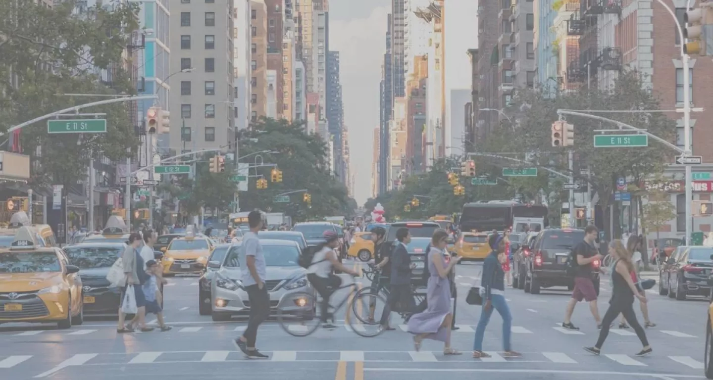 Cars yield to pedestrians in crosswalk in NYC