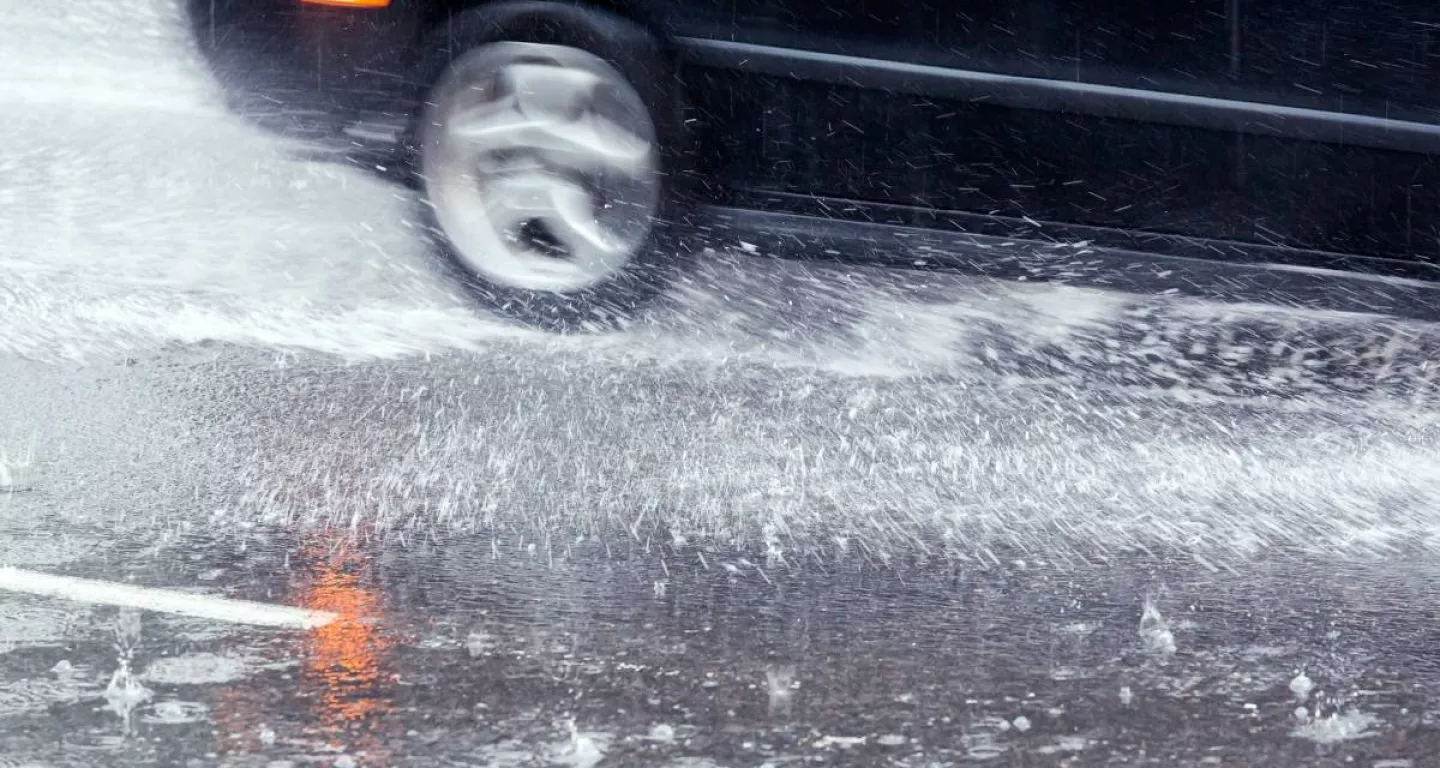 car in rain on New Jersey road
