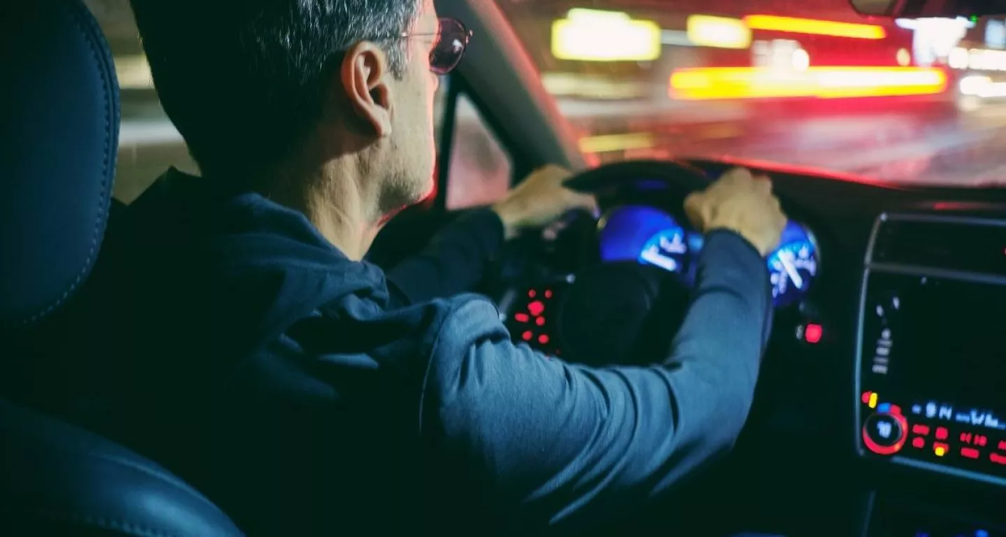 Man driving at night